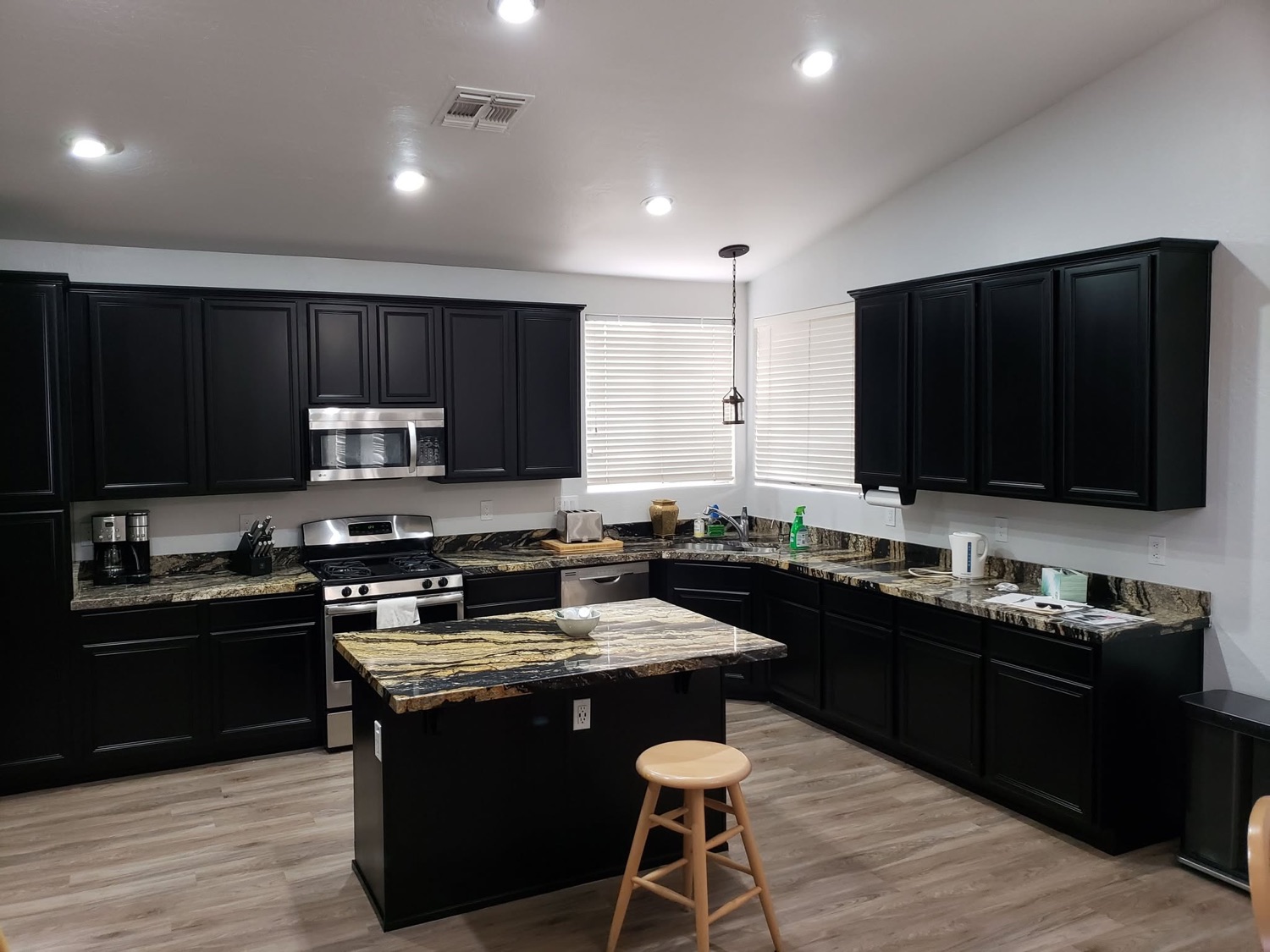 Kitchen cabinets refinished in a rich new colour
