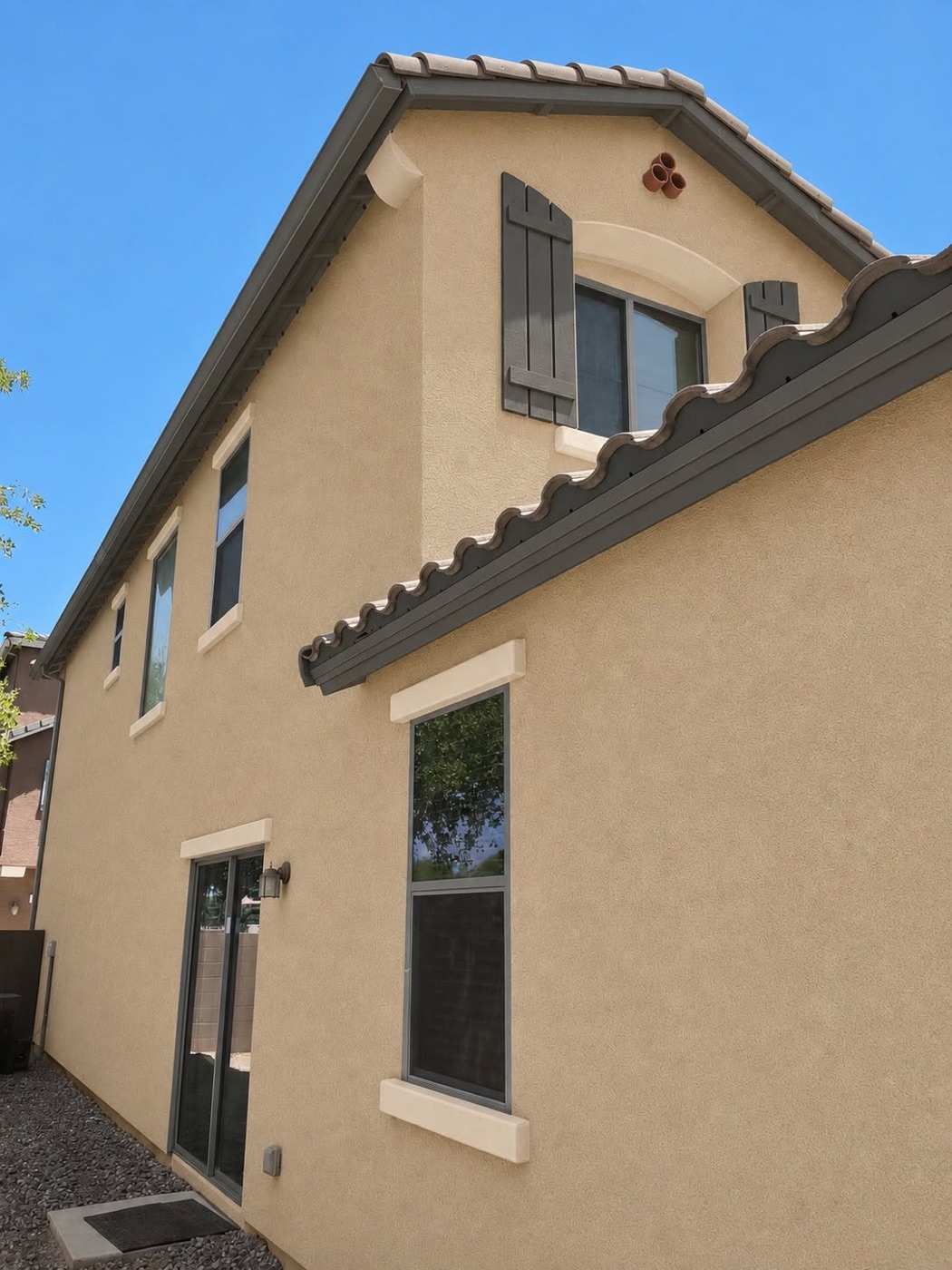 Home exterior with repainted shutters and trim