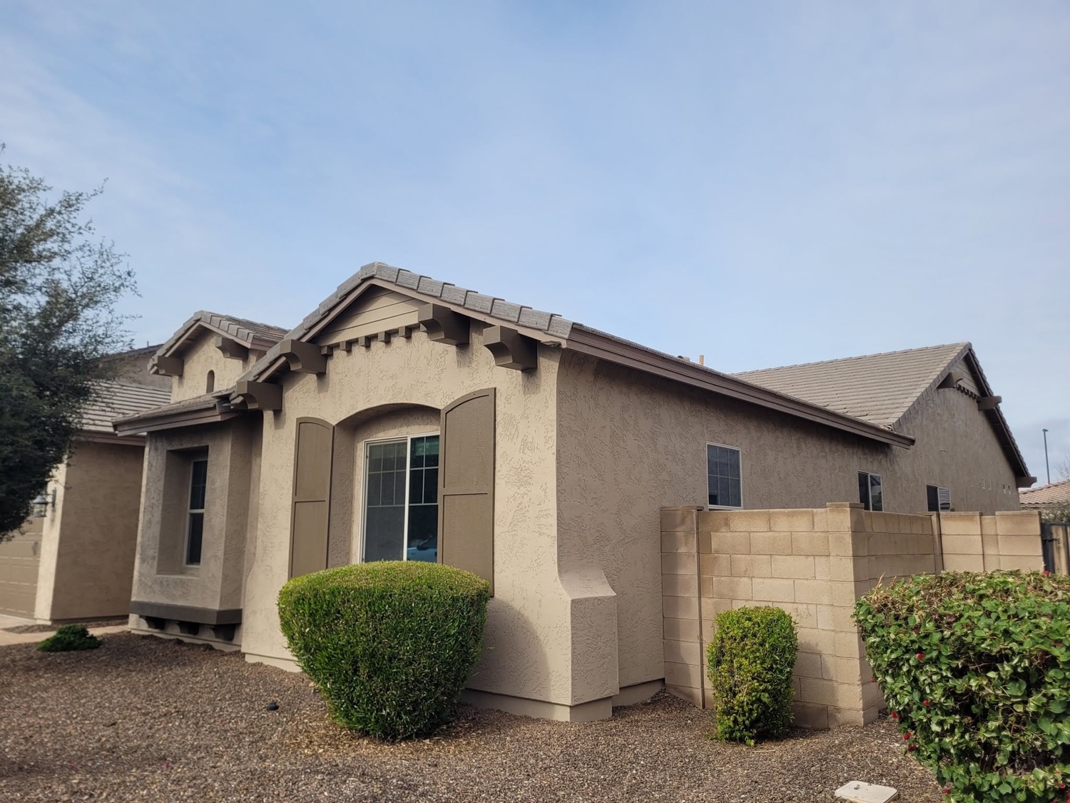 Repainted single-story home exterior with fresh trim
