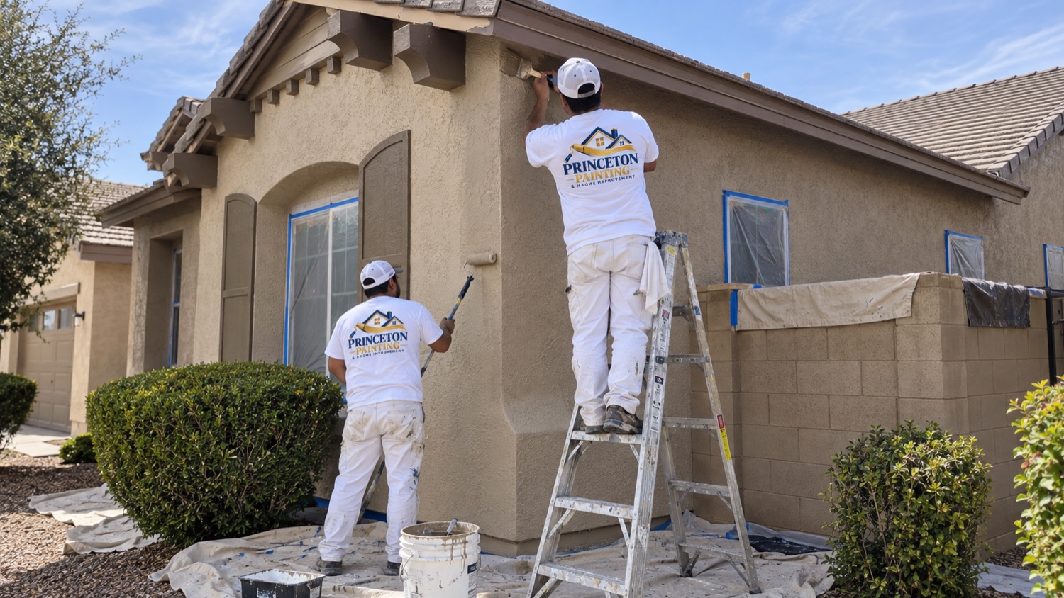 Painters refreshing a home exterior